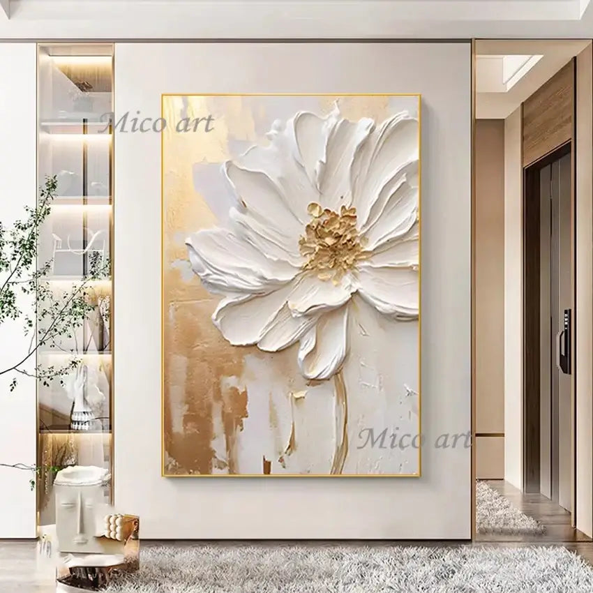 Decorative painting of a white flower with gold accents on a wall in a modern interior setting.