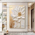 Decorative painting of a white flower with gold accents on a wall in a modern interior setting.