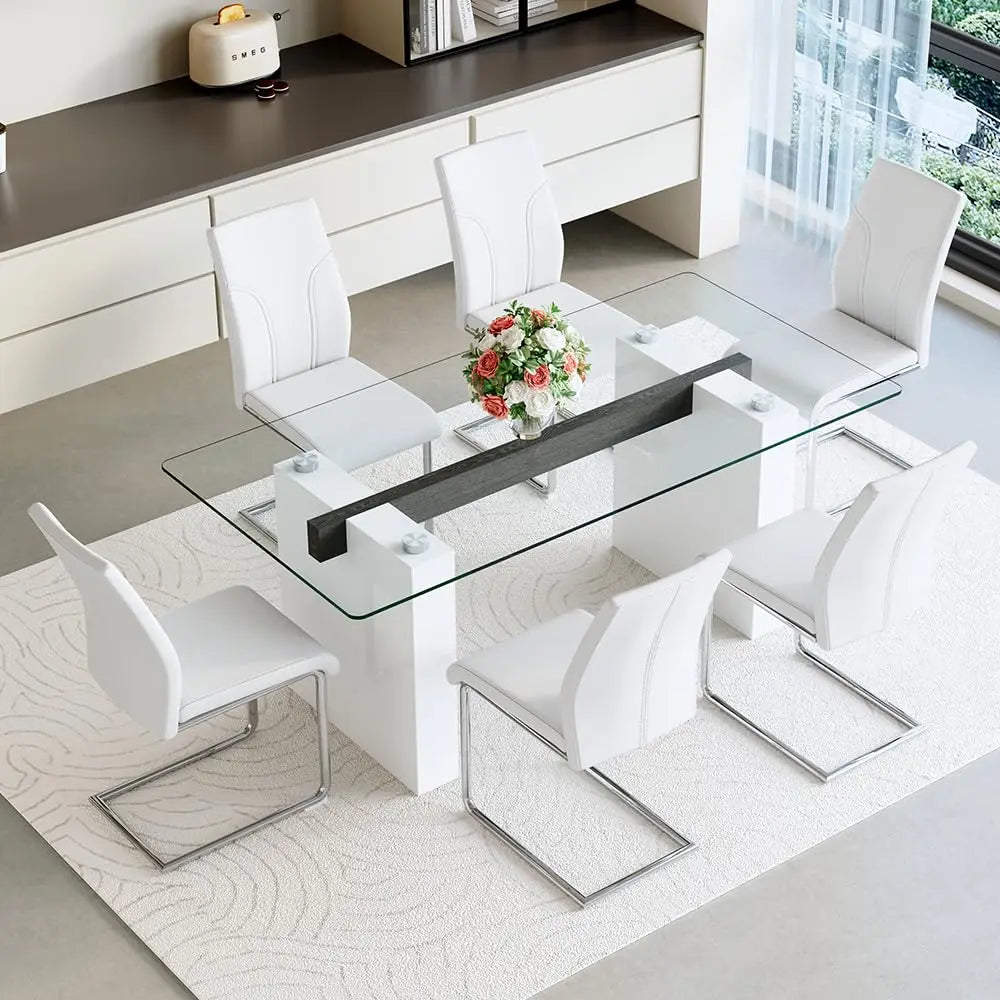 Modern dining set with glass table and white chairs in a bright room.