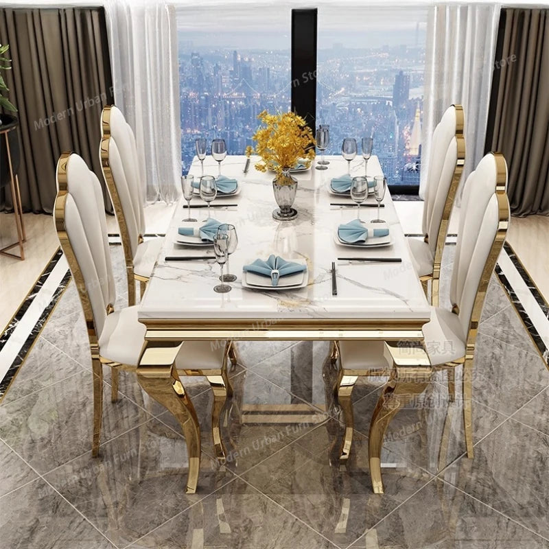 Italian rock slab dining table with chairs set for elegant dining, featuring plush white upholstery and a stunning city view.