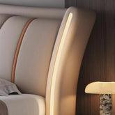 Close-up of a modern headboard with LED strip lighting.