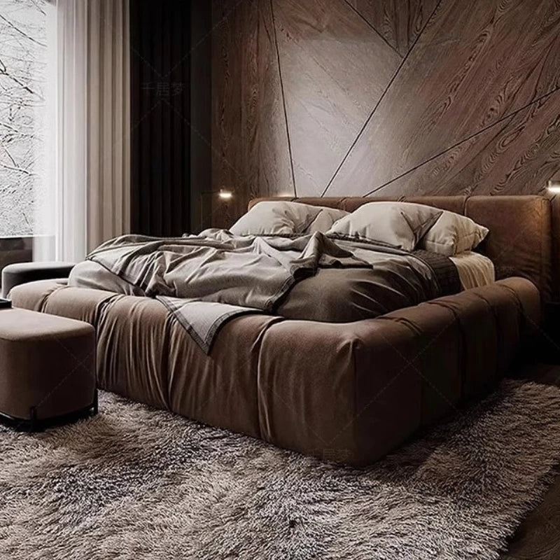Italian upholstered bed frame in a modern bedroom with plush bedding and soft fabric finish.