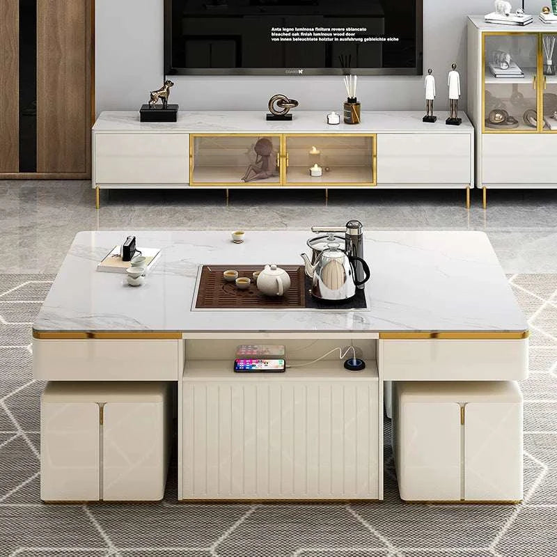 Modern living room with a white marble coffee table, TV, and decorative items.