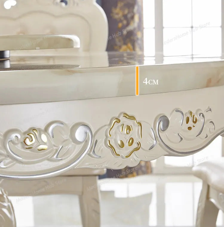 Detailed view of the elegantly carved design on a European marble round dining table with a solid wood base.
