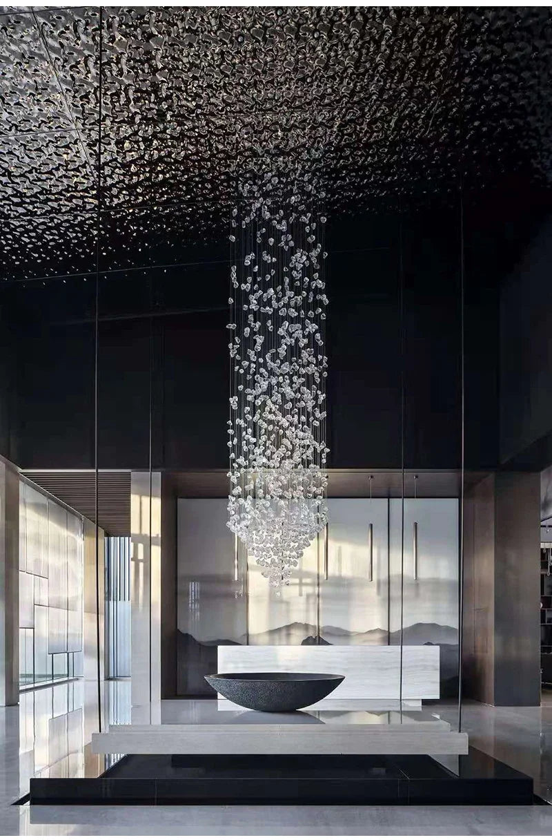 Modern interior with a chandelier hanging from a textured ceiling