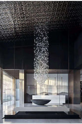 Modern interior with a chandelier hanging from a textured ceiling