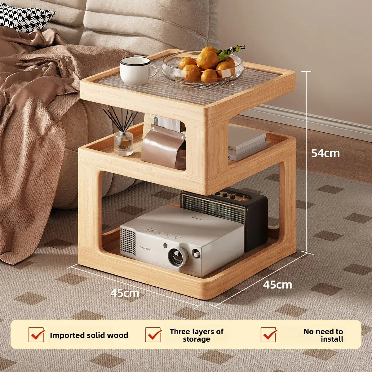 Wooden side table with storage compartments, placed next to a sofa in a living room setting.