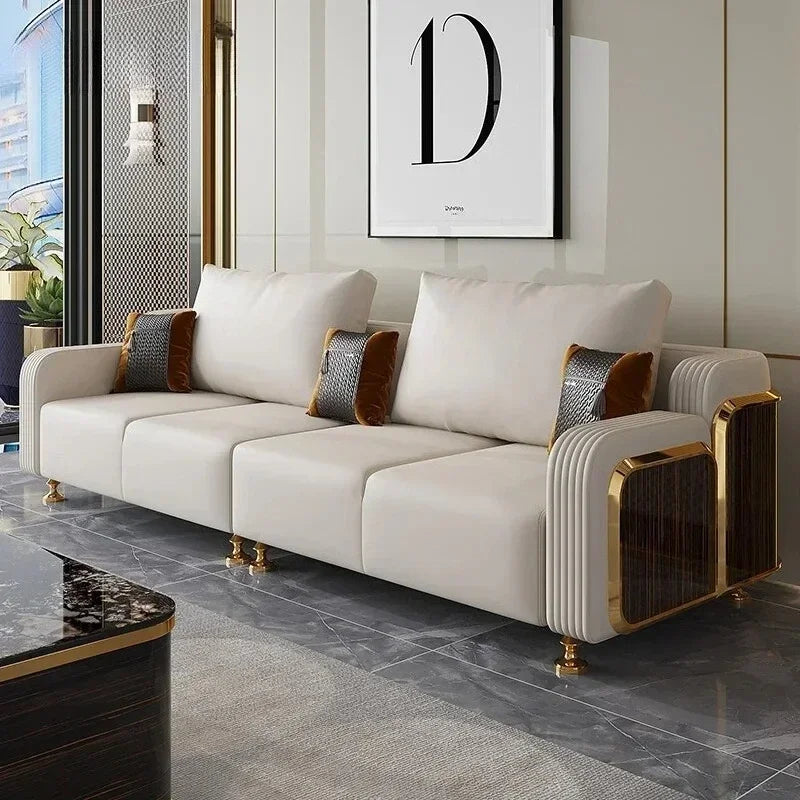 Luxury white sofa with gold accents in a modern living room.