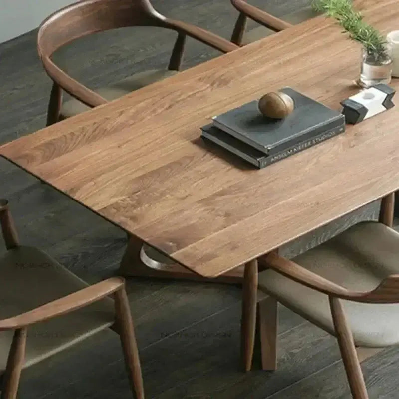 Wooden dining table with chairs in a room setting