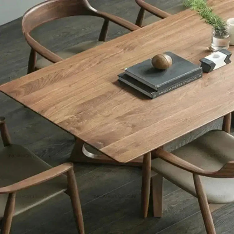 Wooden dining table with chairs in a room setting