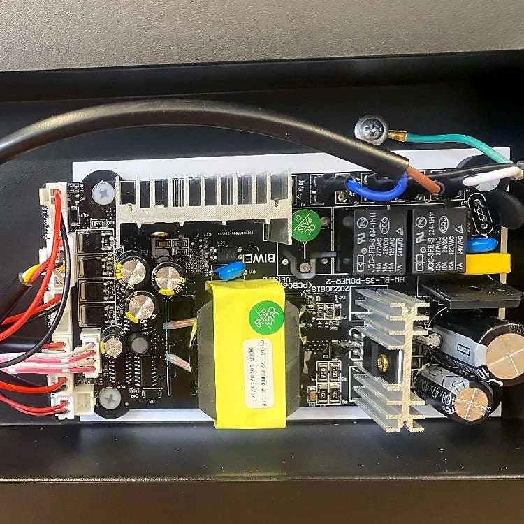 Electrical board with components and wiring on a dark background