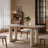 6 person white dining table in modern Nordic living room design with stylish wooden finish and unique base.