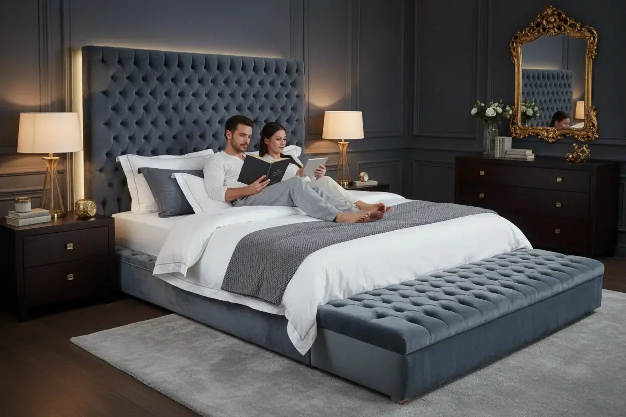 Couple relaxing on a modern upholstered king size bed with tufted velvet headboard in a contemporary bedroom.