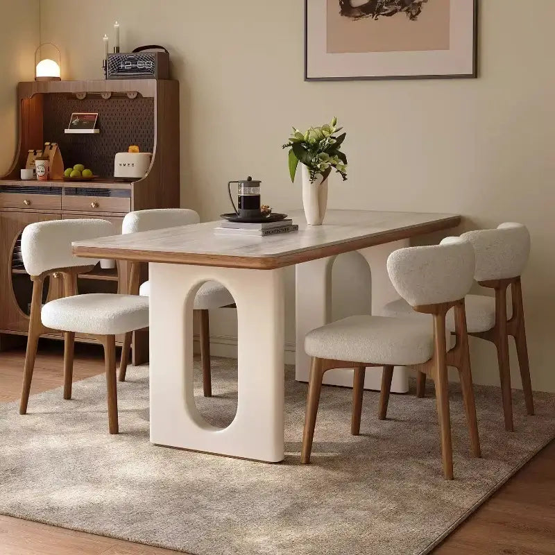6 person white dining table in a modern Nordic living room with stylish chairs and a cozy decor.