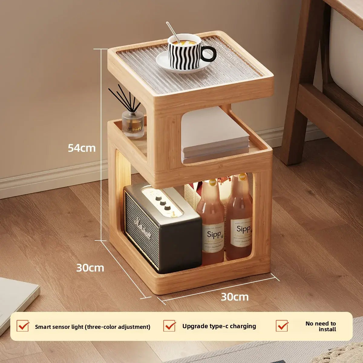 Wooden side table with dimensions and product display on a wooden floor. with coffee on the top and other items on the table shelves