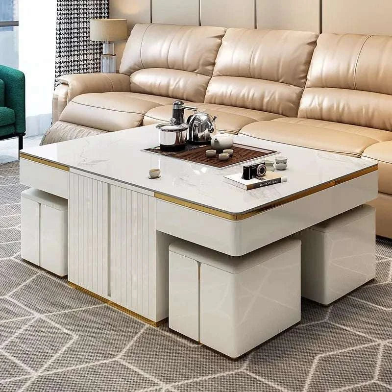 Modern living room with beige sectional sofa and a white coffee table.