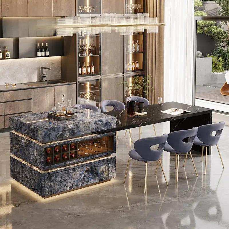 Modern kitchen with marble island, wine storage, and gray chairs.