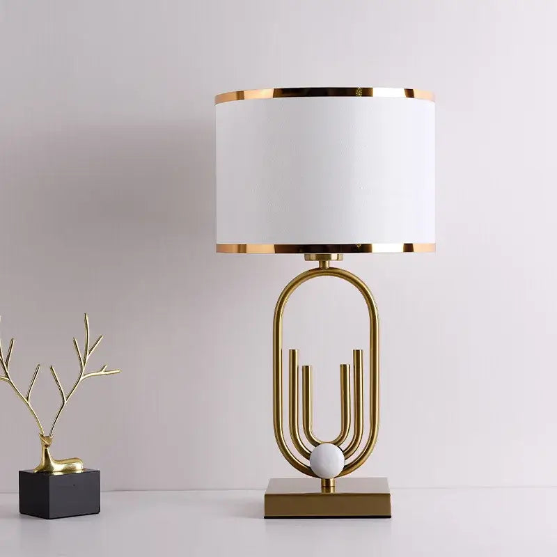 Nordic luxury bedside lamp in gold and white, ideal for creating a warm romantic glow in modern interiors.