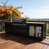Stainless steel outdoor kitchen on wheels with grill, fridge, sink, and wheels for easy mobility.