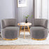 Modern swivel barrel chairs in grey velvet with gold accents, perfect for a stylish living room.