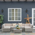 Outdoor patio set with cushions in front of a blue house.