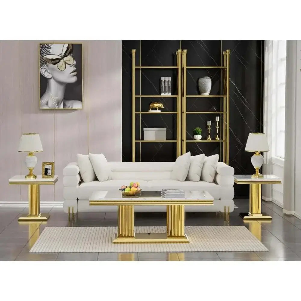 Elegant living room featuring a white faux marble coffee table set with gold accents and modern decor.