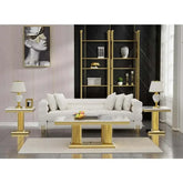 Elegant living room featuring a white faux marble coffee table set with gold accents and modern decor.