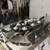 High End Modern Luxury Dining Table Marble Top Golden Stainless Steel Dinning Table Set for Kitchen Hotel Villa in elegant setting.