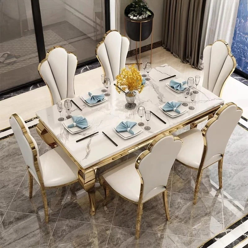 Luxury marble dining table with gold base, elegantly set to seat 6, showcasing Italian style and unique design.