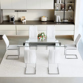 Modern kitchen with a dining table and chairs in a stylish interior setting.