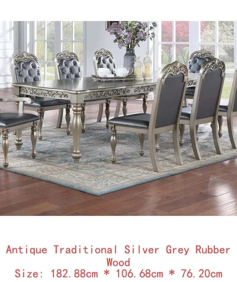 Dining room set with an antique traditional silver grey rubber wood table and chairs.