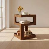 Wooden side table with decorative items near a window with sunlight from the window shining through