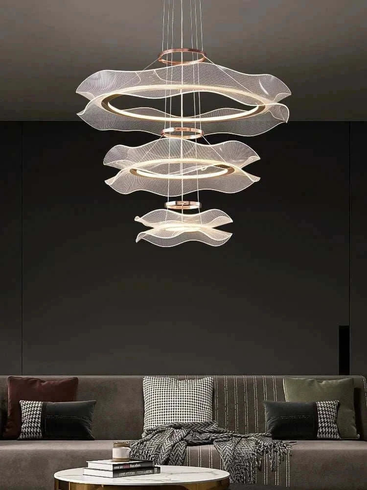 Modern led ceiling chandelier hanging over a stylish living room sofa, enhancing the elegant decor.