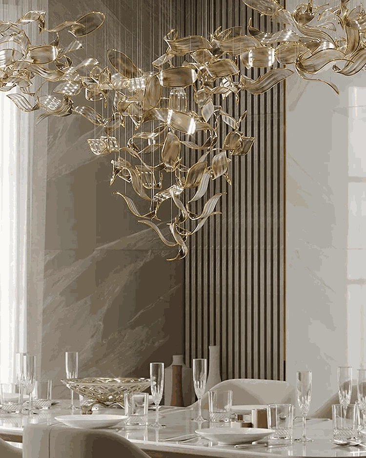 Luxurious chandelier hanging above a dining table with elegant decor.