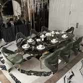 Luxury marble dining table set with elegant chairs, polished marble top, perfect for upscale dining settings.