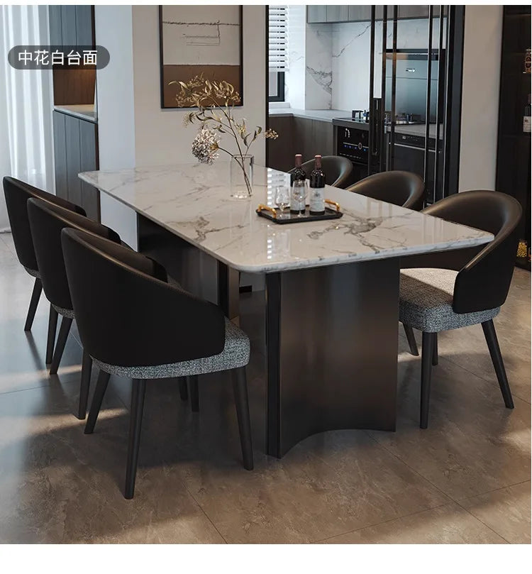 Italian Marble Dining Set featuring a sleek rectangular table and elegant black chairs in a modern dining room.