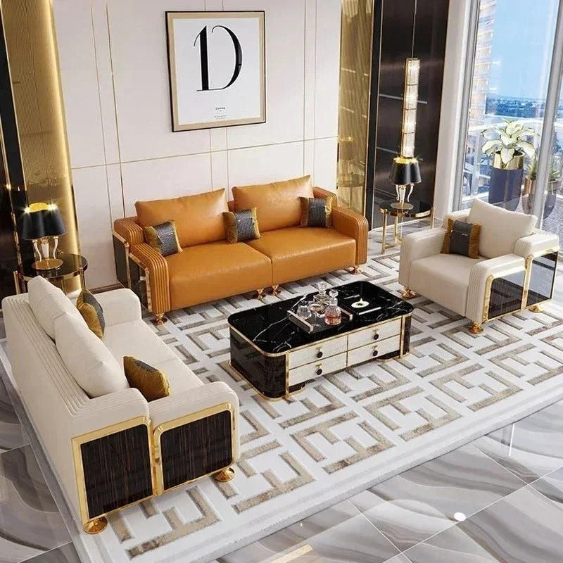 Modern living room with a brown leather sofa, white armchair, and decorative coffee table.