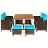 Outdoor furniture set with a wooden table and wicker chairs with blue cushions on a white background