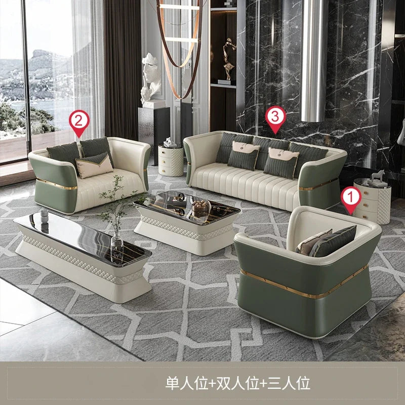 Modern living room with a green and beige sofa set, coffee table, and decorative items.
