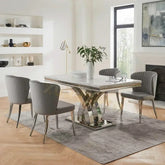 Modern dining room with a marble table and gray chairs.