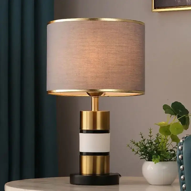Luxury LED bedside lamp with a gold frame and fabric shade, ideal for modern bedroom decor.