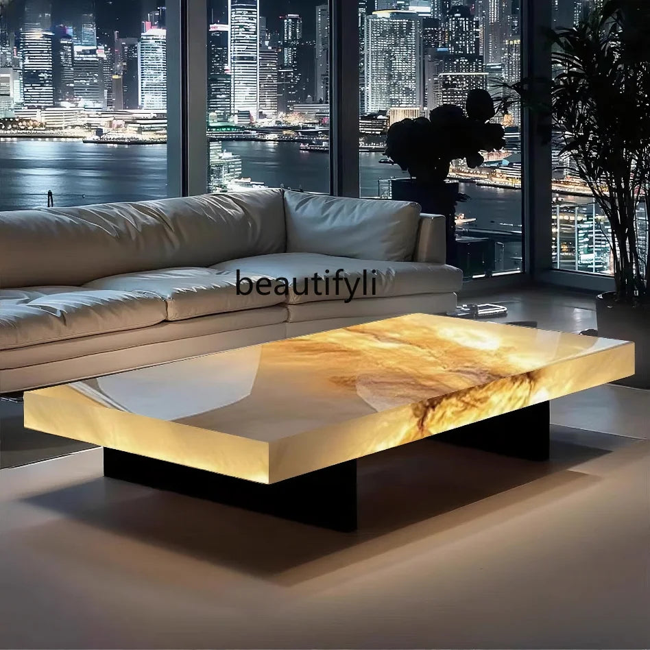 Modern living room with a marble coffee table and city skyline view.
