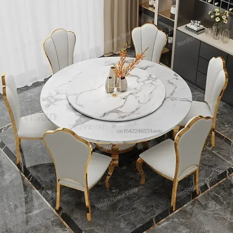 Modern marble glass dining table set with white chairs and a round marble top.
