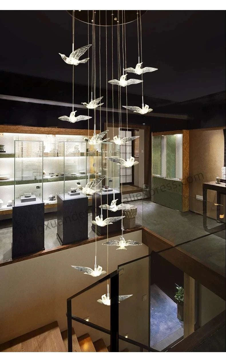 Chandelier with bird-shaped lights in a modern interior setting