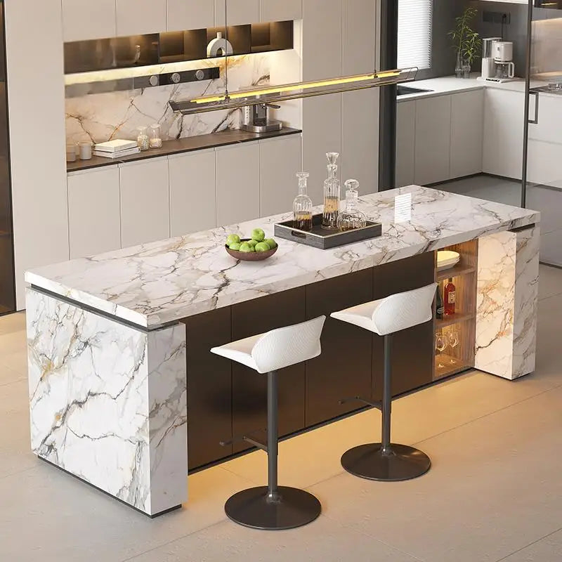 Modern kitchen island with marble countertop and bar stools in a stylish kitchen setting.