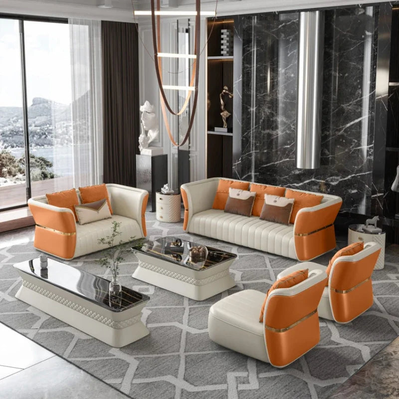 Luxury cowhide leather sofa set in a modern living room with elegant decor and large windows.