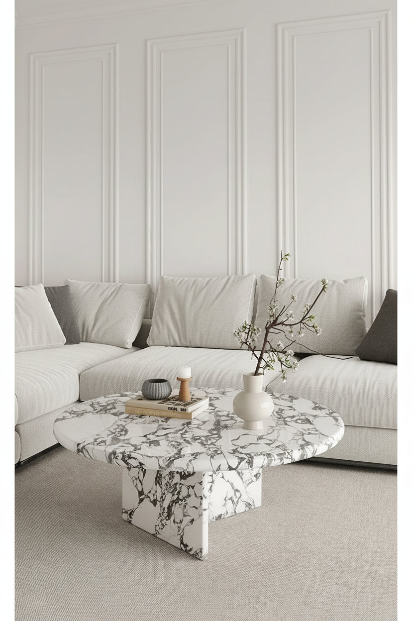 Modern living room with a neutral color palette, marble coffee table, and minimal decor.