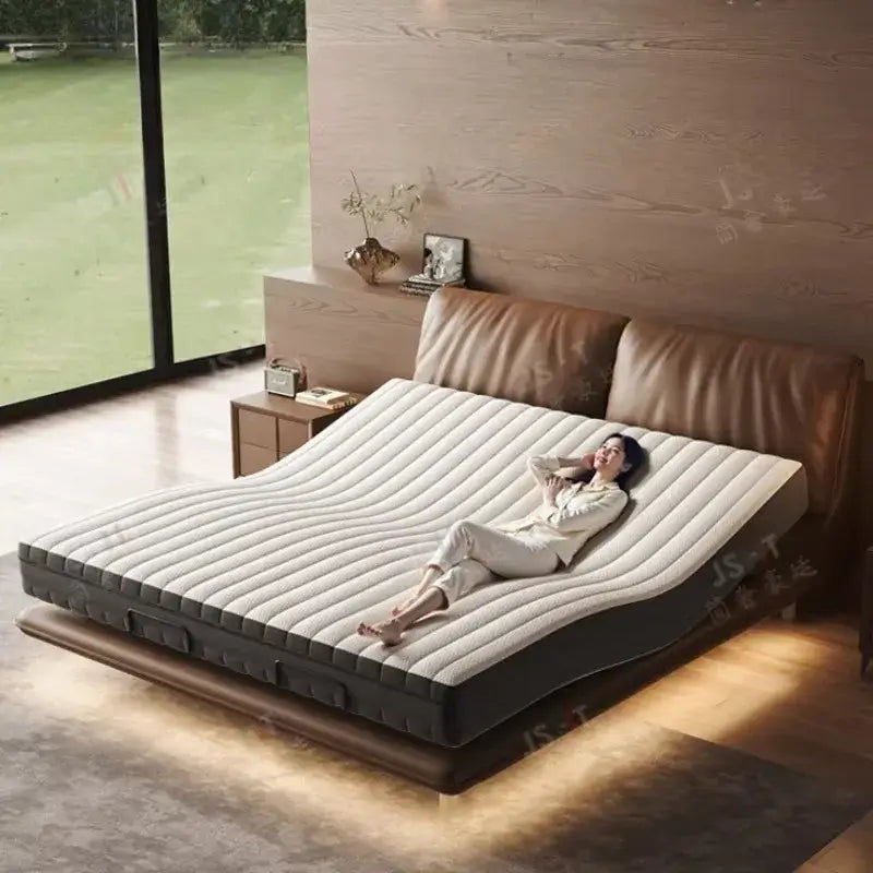 Luxury adjustable smart bed with a modern design and a person relaxing on it, showcasing comfort and style.