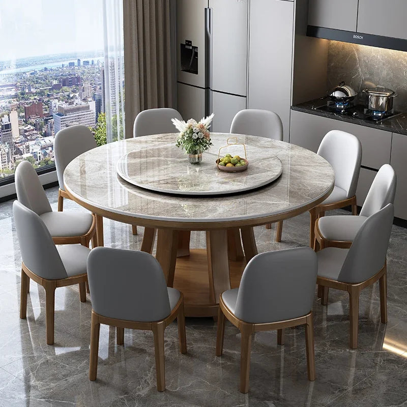 Round dining table with chairs in a modern kitchen with city view