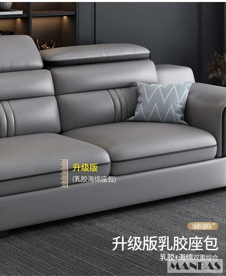 Gray sectional sofa with a decorative pillow in a room setting